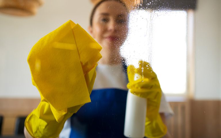 professional-cleaning-service-person-cleaning-office-window